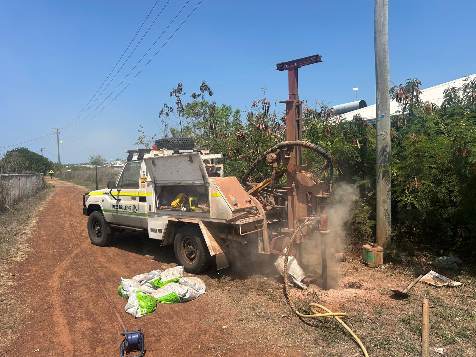 Rees Drilling compact rig working near trees